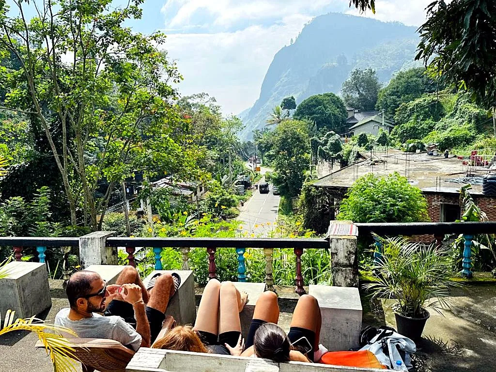 Guests relaxing on the terrace overlooking the road into Ella